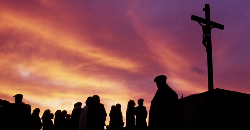 14413-people-look-cross-sunset-sunrise-yellow-orange-purple-clouds-jesus-easter.1200w.tn