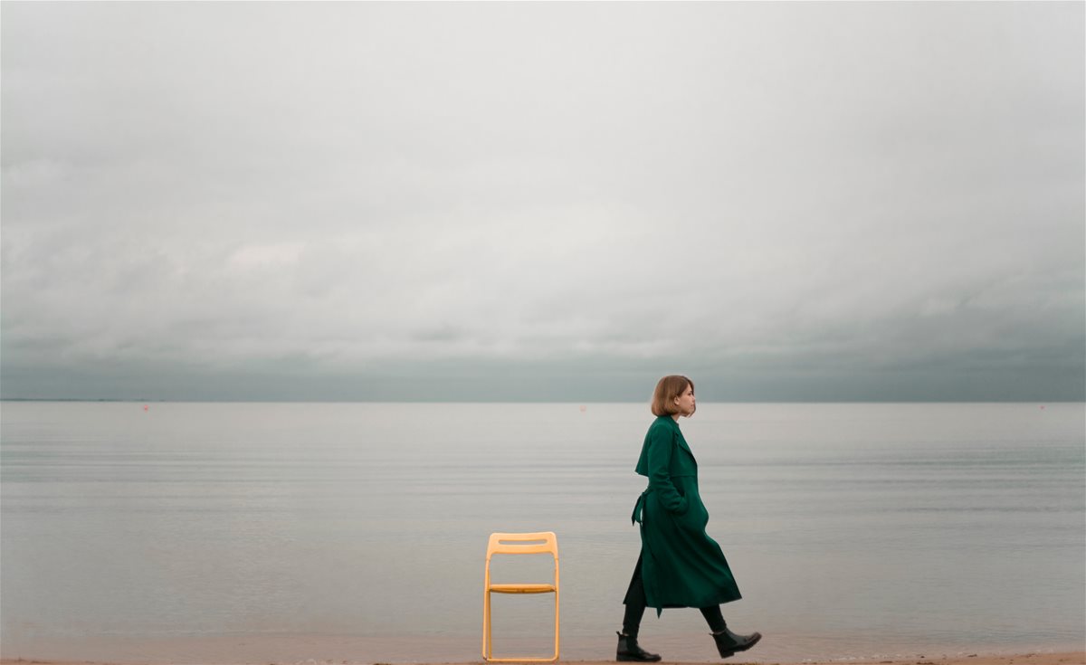 2canva---person-walking-on-seashore